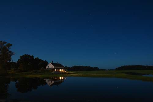 outdoors white house under blue sky night