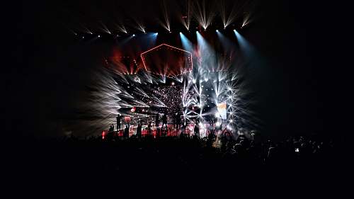 fireworks group of people standing in stage outdoors