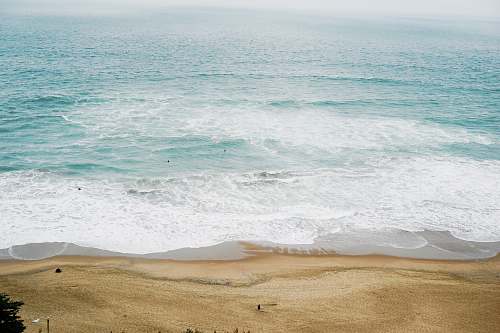 water calm ocean at daytime beach