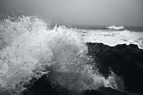 water ocean waves during daytime black-and-white
