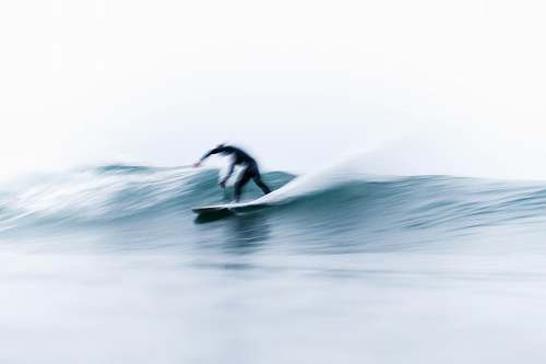 surfing person on surfboard riding waves water