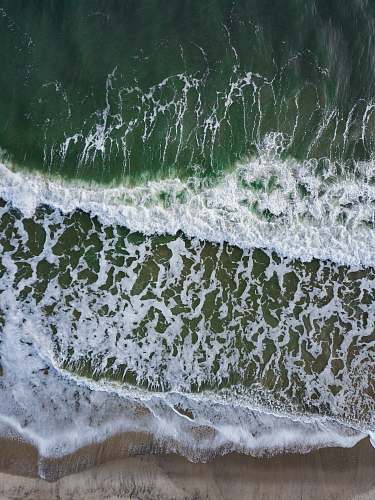 frost aerial photography of seashore snow