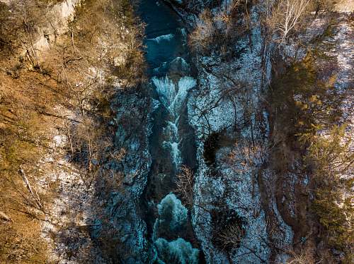 nature aerial photography of waterfalls during day time river