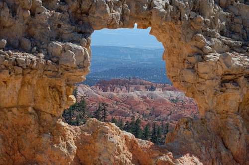 valley closeup photo of arch rock cliff