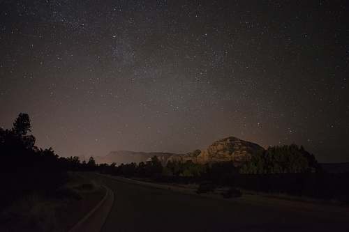 night landscape photography of mountain astronomy