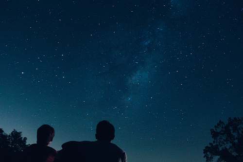 person silhouette photo of two person watching stars human