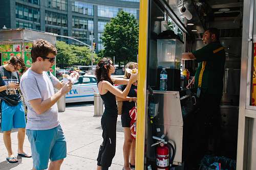 human four person standing in front store person