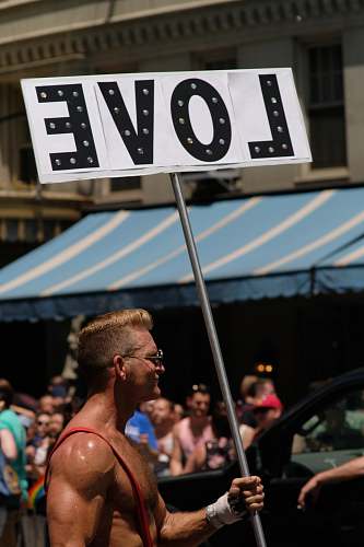 human man holding love banner person