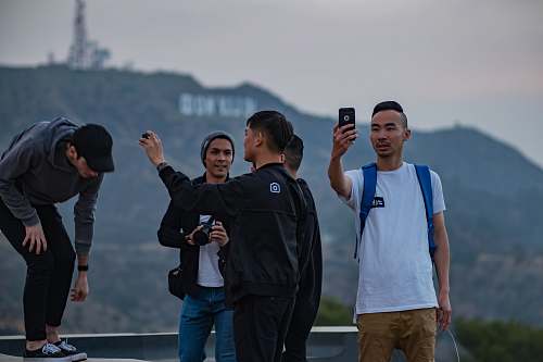 person people taking photo on building human