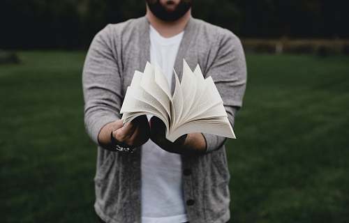 human person opening book person