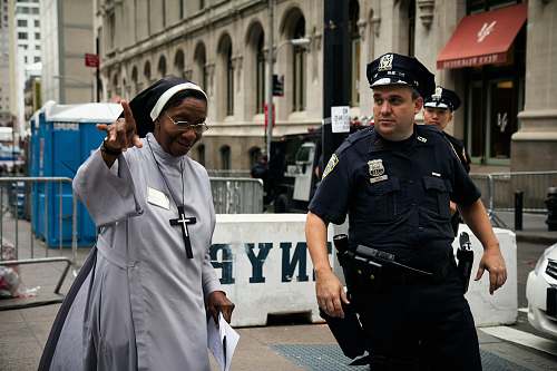 human policeman assist a nun police