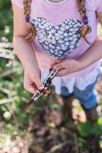 human woman holding gray knife with soils person