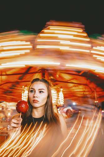 human woman holding pomegranate candy person