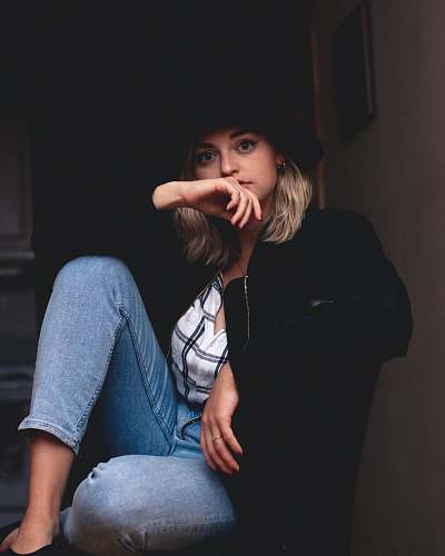 person woman in blue jeans and black jacket human