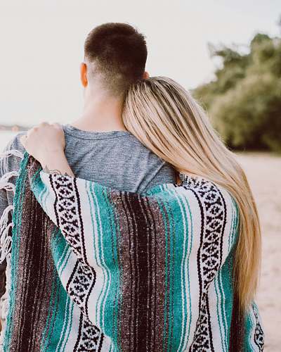 woman woman's hand on man's shoulder blonde