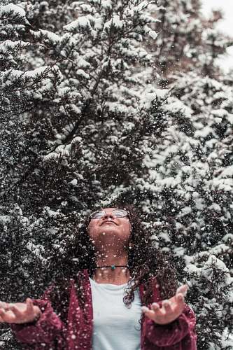 human girl leaning above during with snow people