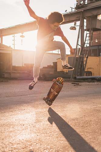 human man skate boarding during daytime skateboard