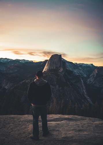 human man standing on rock formation people