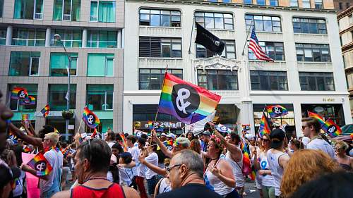human people holding pride flag flag