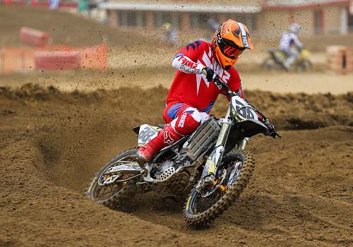 motocross person riding on motocross dirt bike motorcycle