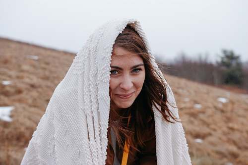 human smiling woman wrapped with white headscarf people
