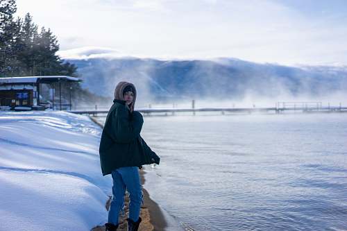human woman standing beside sea apparel
