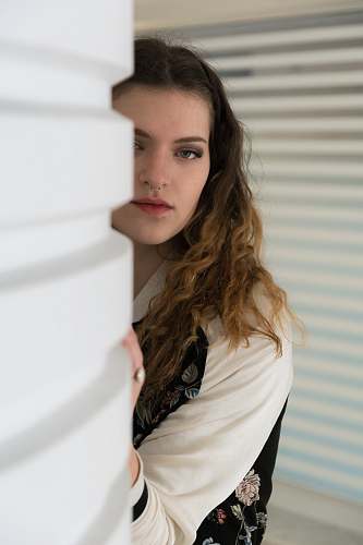 human woman standing beside the wall people