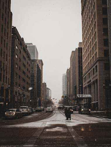 intersection road with buildings under white sky asphalt