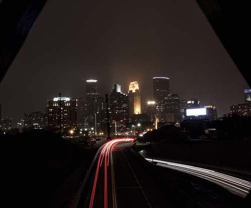 freeway timelapse photography of buildings highway