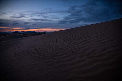 desert desert sand under orange sky dune