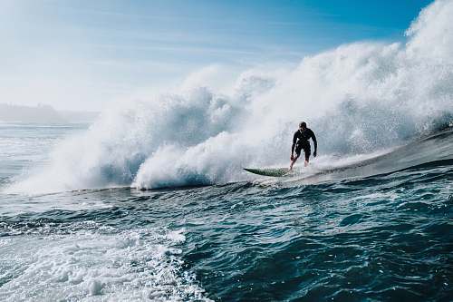 nature man doing surfing during daytime outdoors