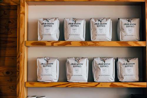 wood wood burl coffee packs on wooden shelf press coffee