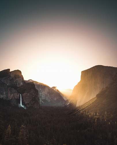 nature brown mountains during daytime sunrise