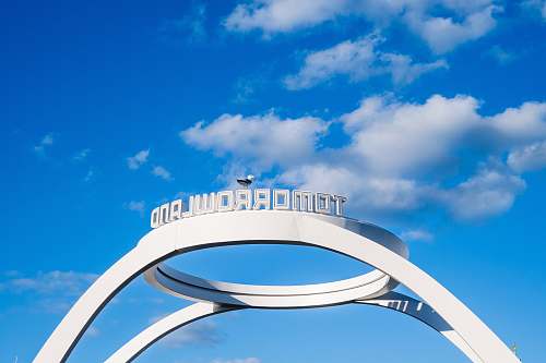 building white and blue round frame under blue sky during daytime architecture