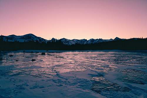nature photo of lake in forest during sunrise mountain