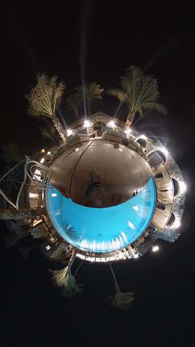 light brown swimming pool and coconut palm trees little planet flare