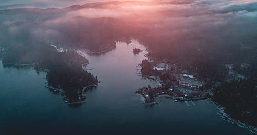 sunset aerial photography of land and sea aerial view