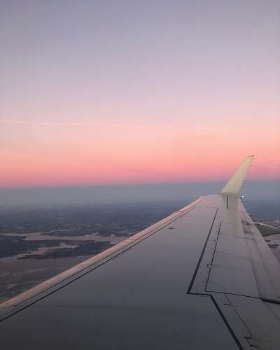 sunset white airplane wing sky