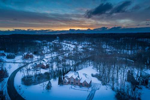 sunrise aerial photography of houses covered with snows building