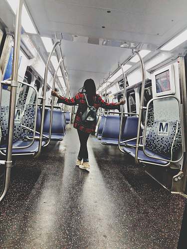 train woman standing inside train train station
