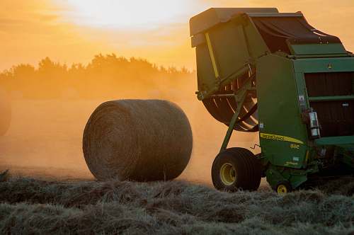 transportation green heavy equipment and hay roll vehicle