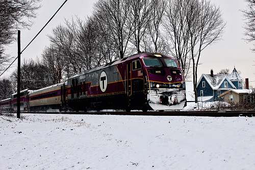 transportation red and grey train running on train tracks vehicle