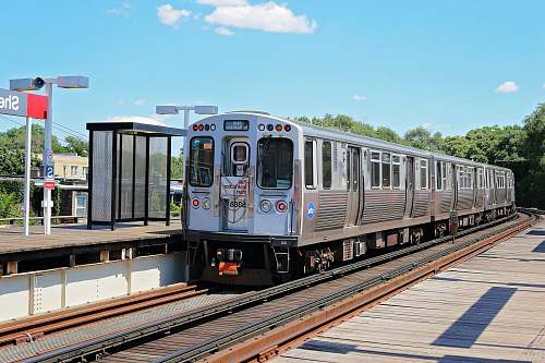 transportation silver train near station vehicle