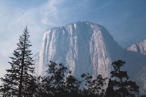 mountain gray mountain under the blue sky during daytime peak