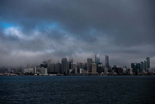 city city with high-rise buildings viewing sea under gray skies town