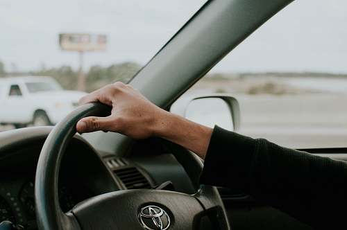 driving person driving Toyota car transportation