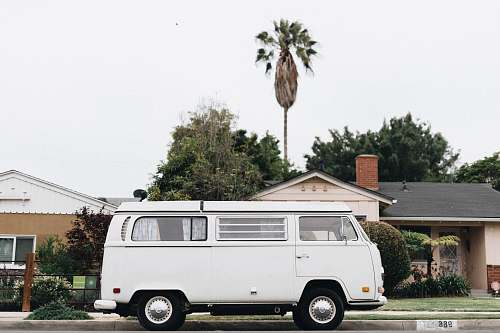 caravan white van in front of house transportation