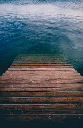 ocean brown wooden stair on calm body of water belmar