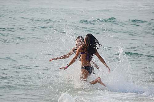 ocean two women walking on body of water play