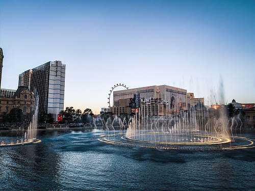 fountain water fountain in the middle of the city during daytime bellagio